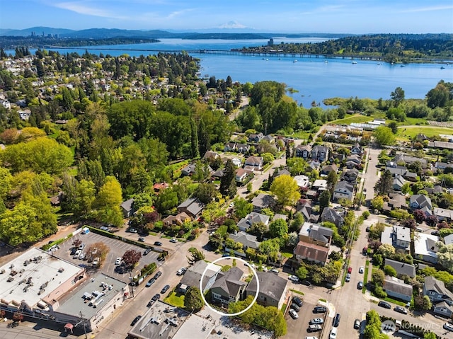 birds eye view of property featuring a residential view and a water and mountain view