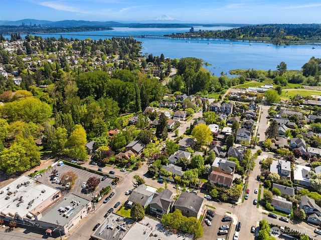 birds eye view of property with a water and mountain view and a residential view