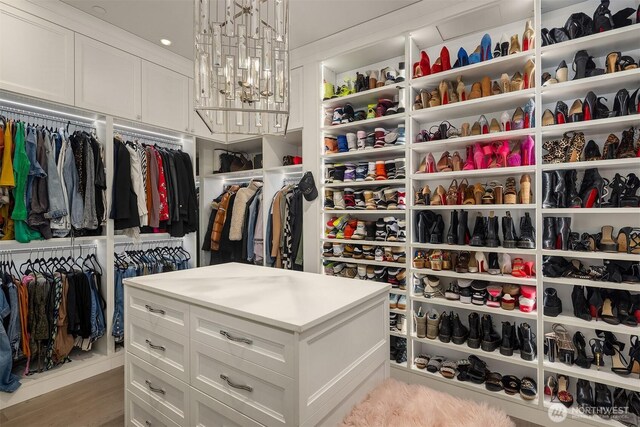209 Northside Rd, Bellevue, WA 98004 - spacious closet with wood finished floors and a chandelier