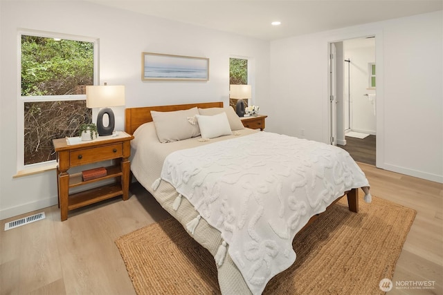 bedroom featuring recessed lighting, baseboards, light wood finished floors, and visible vents