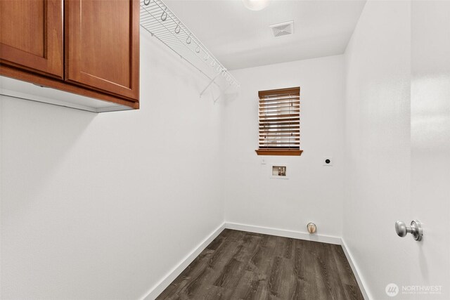 laundry room with cabinet space, hookup for a washing machine, baseboards, electric dryer hookup, and visible vents