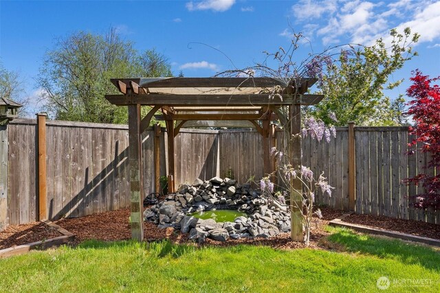 view of yard with a fenced backyard and a pergola