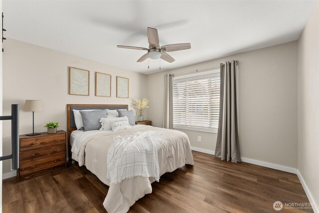 bedroom with baseboards, ceiling fan, and dark wood-style floors