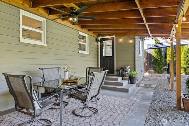 view of patio with ceiling fan and outdoor dining area