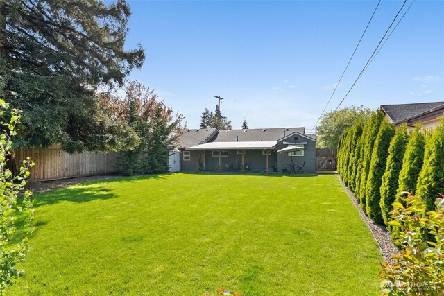 view of yard featuring a fenced backyard