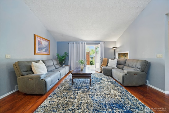 living room featuring baseboards, a textured ceiling, wood finished floors, and lofted ceiling