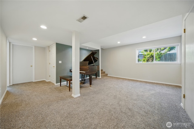 below grade area featuring carpet floors, recessed lighting, visible vents, and stairway