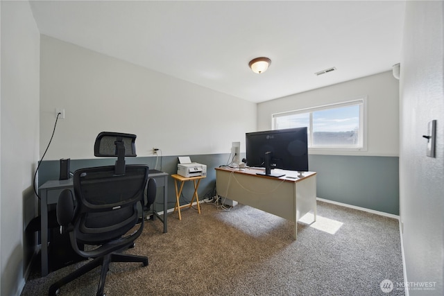 carpeted home office featuring baseboards and visible vents
