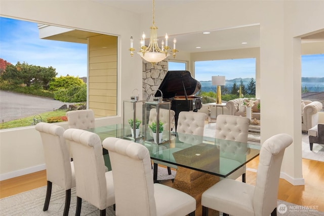 5310 143rd Ave SE, Bellevue, WA 98006 - dining area with wood finished floors, a chandelier, baseboards, and recessed lighting