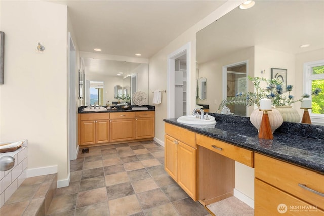5310 143rd Ave SE, Bellevue, WA 98006 - full bath with baseboards, two vanities, a shower stall, recessed lighting, and stone finish flooring