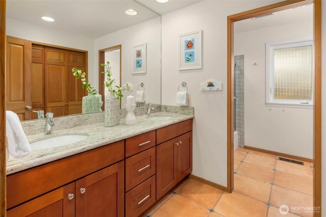 5310 143rd Ave SE, Bellevue, WA 98006 - full bath with double vanity, tile patterned flooring, baseboards, and recessed lighting