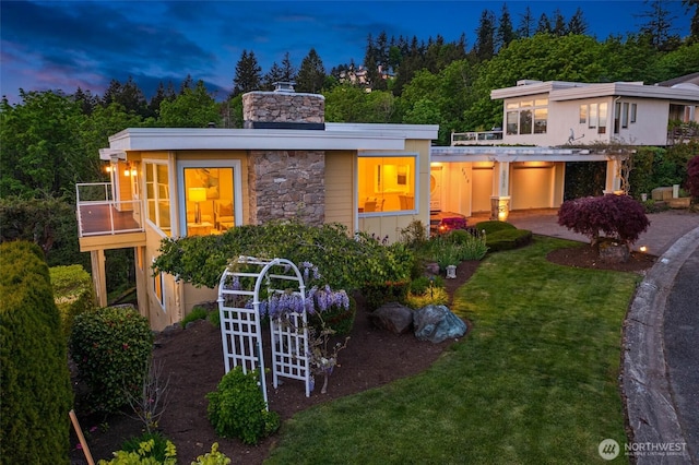 5310 143rd Ave SE, Bellevue, WA 98006 - contemporary house featuring a chimney, a front yard, and stone siding