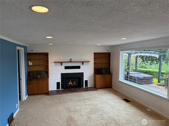 21926 Vashon Hwy SW, Vashon, WA 98070 - unfurnished living room featuring carpet, baseboards, a fireplace, a textured ceiling, and recessed lighting