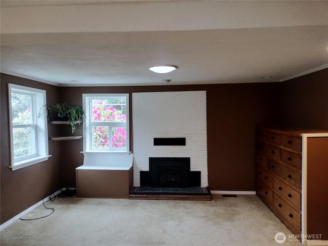 21926 Vashon Hwy SW, Vashon, WA 98070 - unfurnished living room with light carpet, a brick fireplace, and baseboards