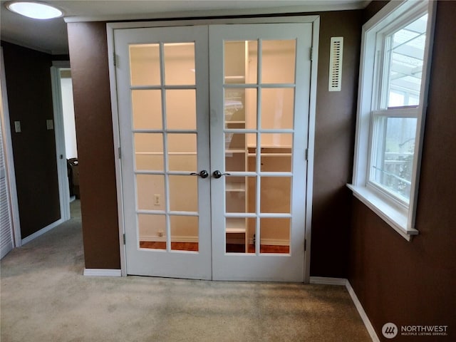 21926 Vashon Hwy SW, Vashon, WA 98070 - doorway featuring french doors, carpet floors, and baseboards