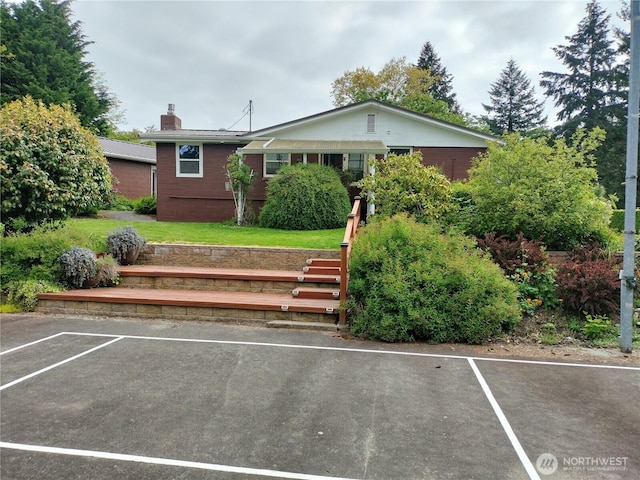 21926 Vashon Hwy SW, Vashon, WA 98070 - view of front of house featuring a chimney and uncovered parking