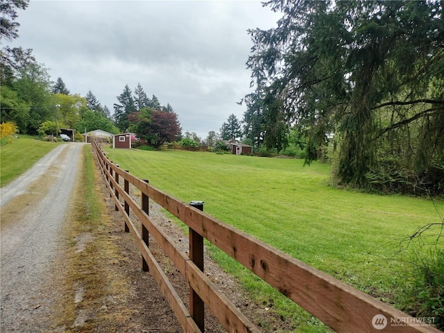 21926 Vashon Hwy SW, Vashon, WA 98070 - view of yard with dirt driveway, a storage shed, and an outbuilding