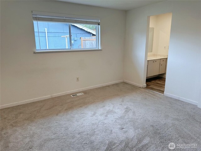 1615 S 90th St, Tacoma, WA 98444 - spare room featuring visible vents, carpet flooring, and baseboards