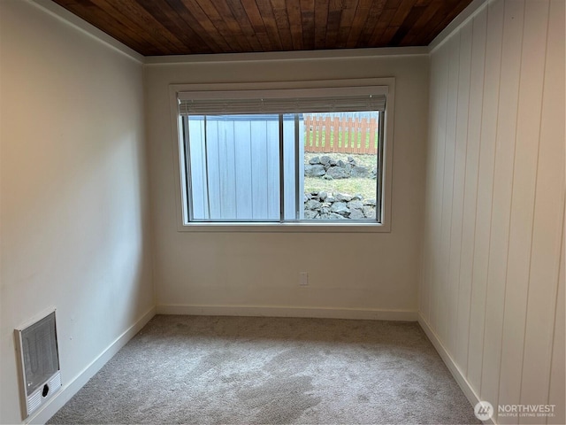 1615 S 90th St, Tacoma, WA 98444 - carpeted empty room with visible vents, wood walls, wood ceiling, and baseboards