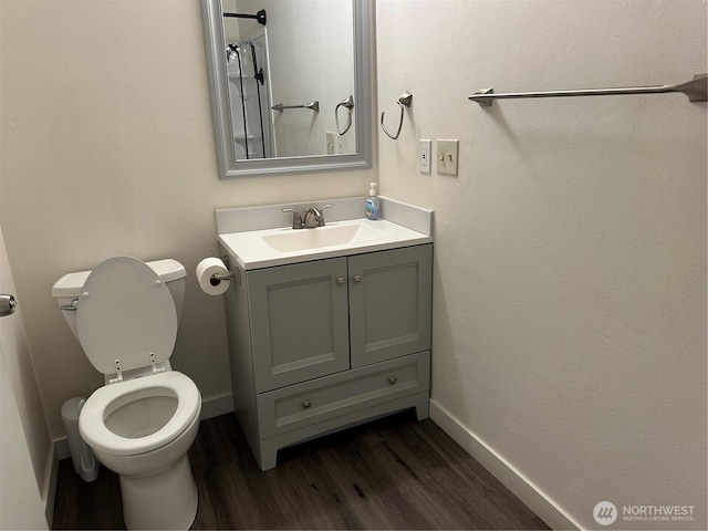1615 S 90th St, Tacoma, WA 98444 - bathroom with toilet, baseboards, wood finished floors, and vanity