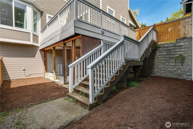 exterior space featuring stairway and a wooden deck