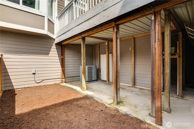 view of patio featuring central AC unit and an exterior structure