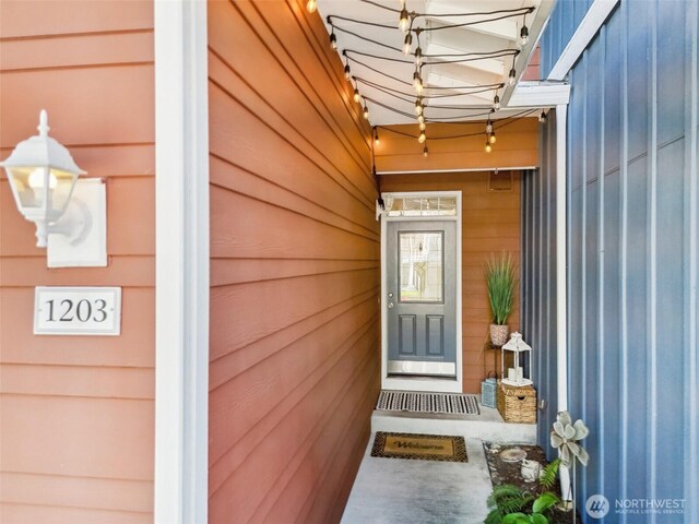 doorway to property with board and batten siding
