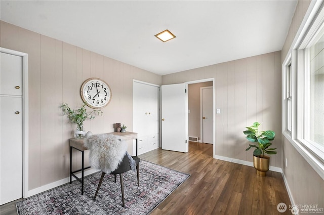 home office with wood finished floors and visible vents