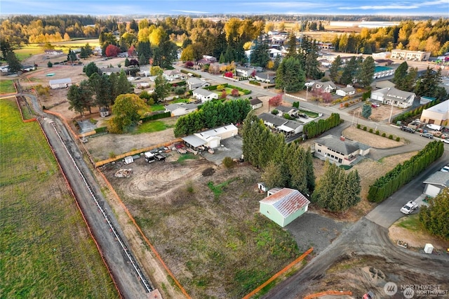 birds eye view of property with a residential view