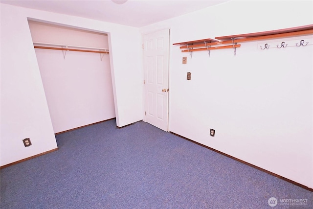 unfurnished bedroom featuring baseboards and a closet