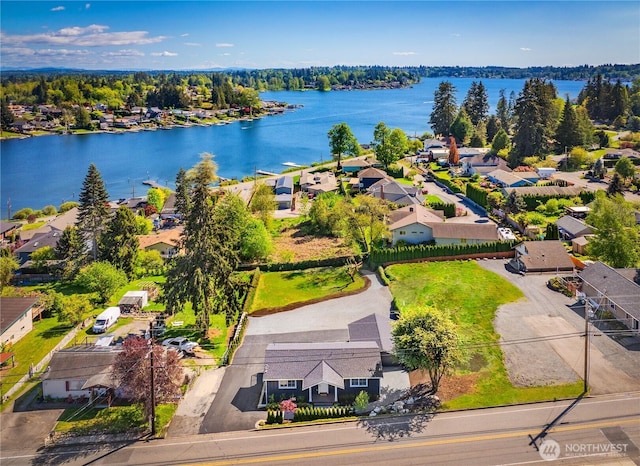bird's eye view with a residential view and a water view