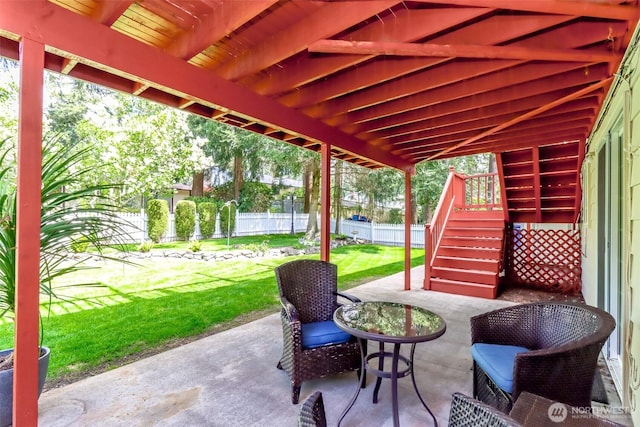 view of patio featuring a fenced backyard and stairway