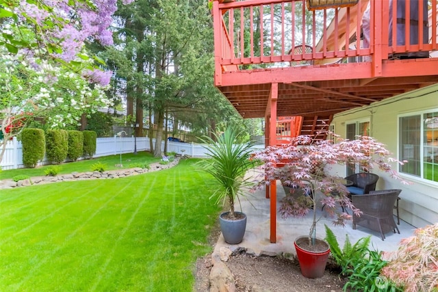 view of yard featuring a patio, fence private yard, and a deck