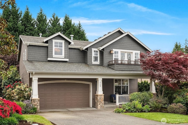 325 6th Ave S, Kirkland, WA 98033 - craftsman-style home with a shingled roof, a garage, a porch, concrete driveway, and a balcony