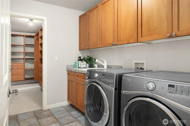 325 6th Ave S, Kirkland, WA 98033 - washroom with stone finish floor, washing machine and clothes dryer, cabinet space, a sink, and baseboards