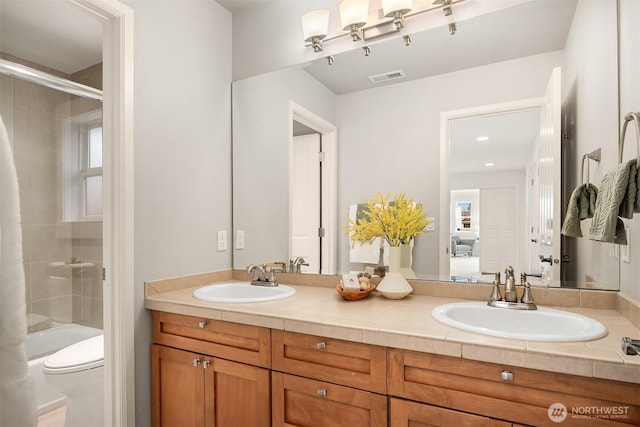 325 6th Ave S, Kirkland, WA 98033 - full bath featuring double vanity, a sink, visible vents, and toilet