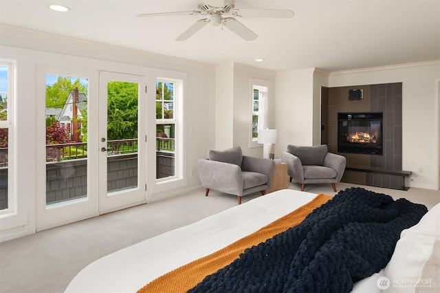 325 6th Ave S, Kirkland, WA 98033 - carpeted bedroom featuring french doors, access to exterior, crown molding, a tiled fireplace, and recessed lighting