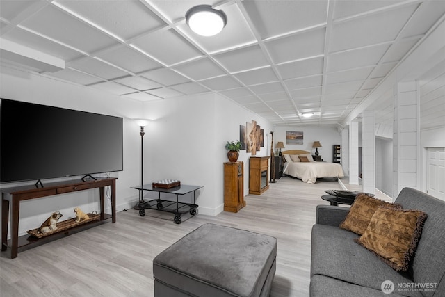 living room with baseboards and wood finished floors