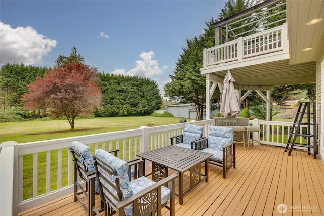 wooden terrace with a yard
