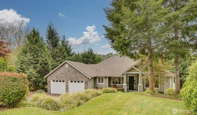 view of front of house with a front yard, stone siding, and a garage