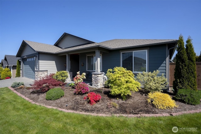 71 Lillian Ridge Dr, Sequim, WA 98382 - view of front facade with covered porch, a shingled roof, and a garage