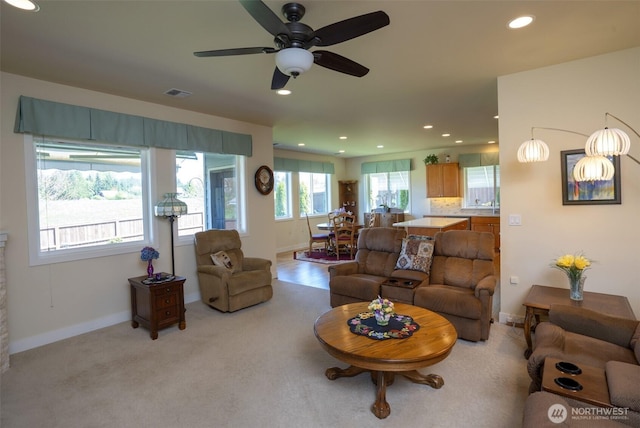 71 Lillian Ridge Dr, Sequim, WA 98382 - living room with recessed lighting, light colored carpet, ceiling fan, baseboards, and visible vents