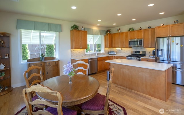 71 Lillian Ridge Dr, Sequim, WA 98382 - kitchen featuring backsplash, appliances with stainless steel finishes, light countertops, and a sink