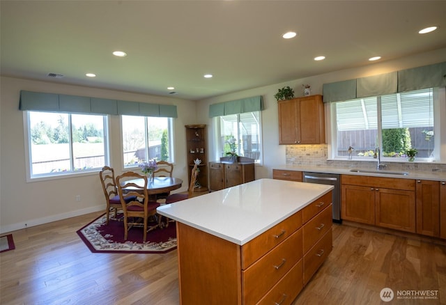 71 Lillian Ridge Dr, Sequim, WA 98382 - kitchen featuring brown cabinets, stainless steel dishwasher, a sink, visible vents, and recessed lighting