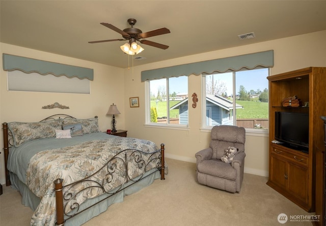 71 Lillian Ridge Dr, Sequim, WA 98382 - carpeted bedroom featuring baseboards, visible vents, and a ceiling fan