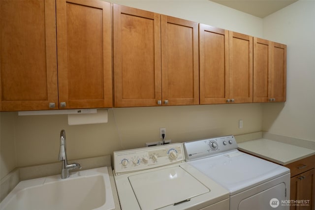 71 Lillian Ridge Dr, Sequim, WA 98382 - laundry room with washing machine and dryer, a sink, and cabinet space