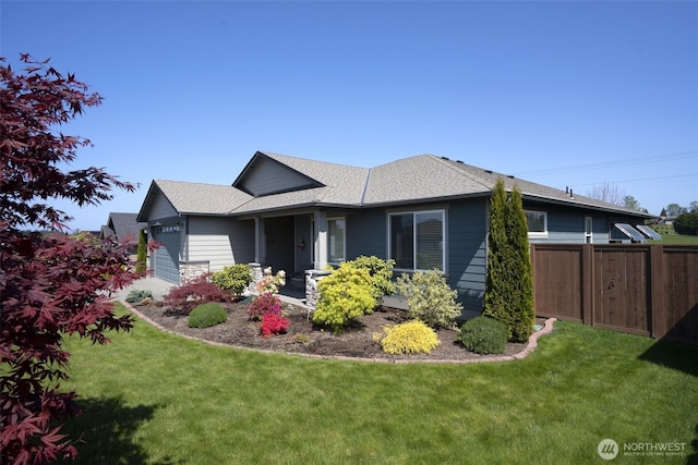71 Lillian Ridge Dr, Sequim, WA 98382 - view of front of property featuring fence, roof with shingles, a front yard, and a garage