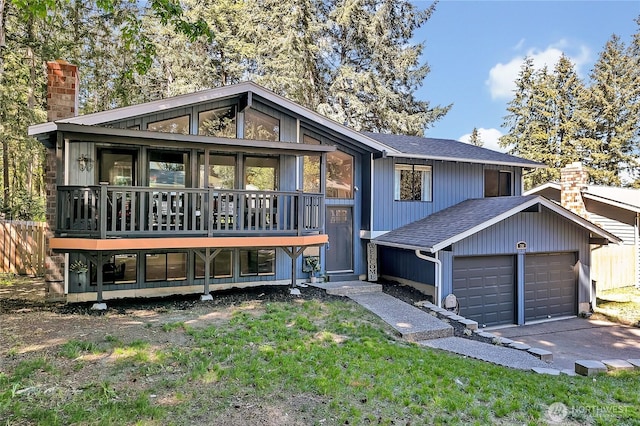 791 NE Pinecrest Dr, Bremerton, WA 98311 - view of front facade with a chimney, a shingled roof, an attached garage, and driveway