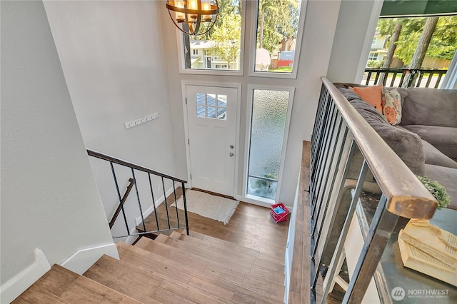 791 NE Pinecrest Dr, Bremerton, WA 98311 - foyer with a chandelier, wood finished floors, baseboards, and stairs