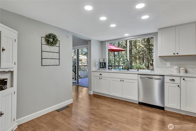 791 NE Pinecrest Dr, Bremerton, WA 98311 - kitchen featuring dishwasher, a sink, recessed lighting, white cabinets, and light wood-style flooring